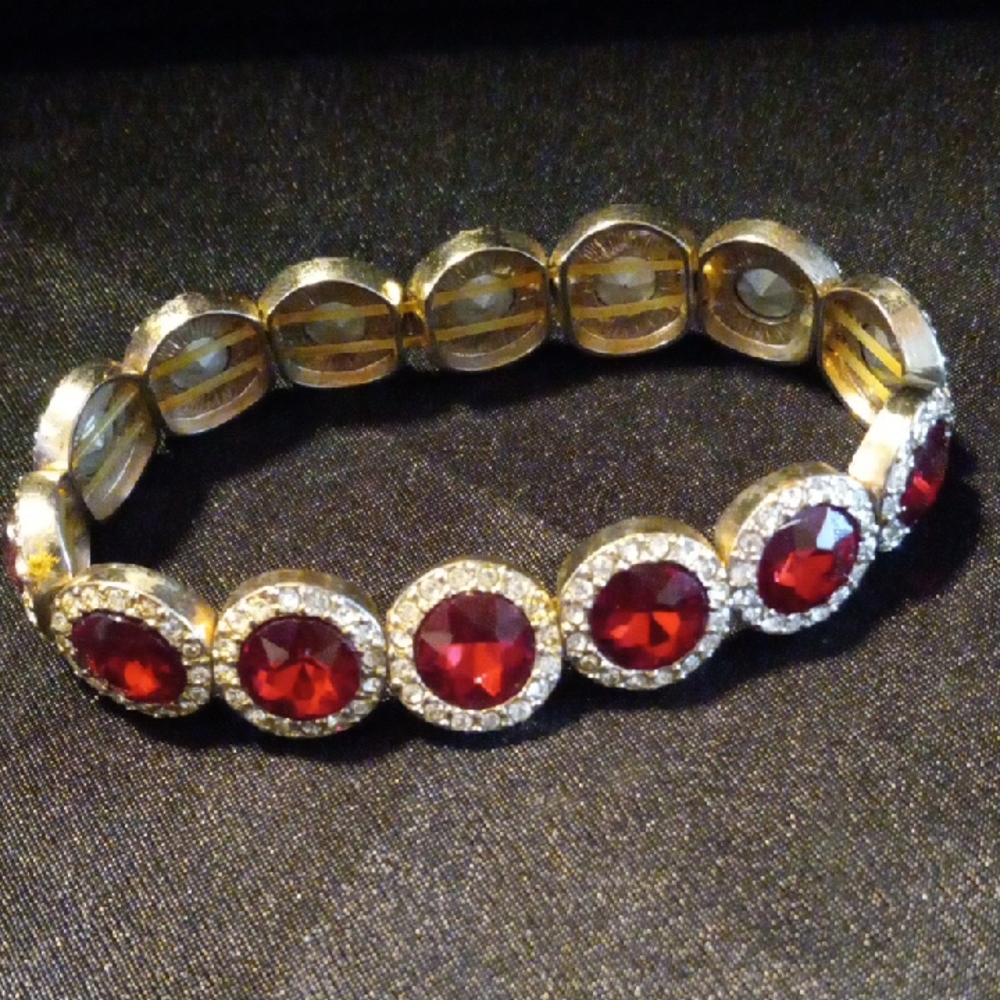 Elegant Gold Bracelet with Red Gemstones